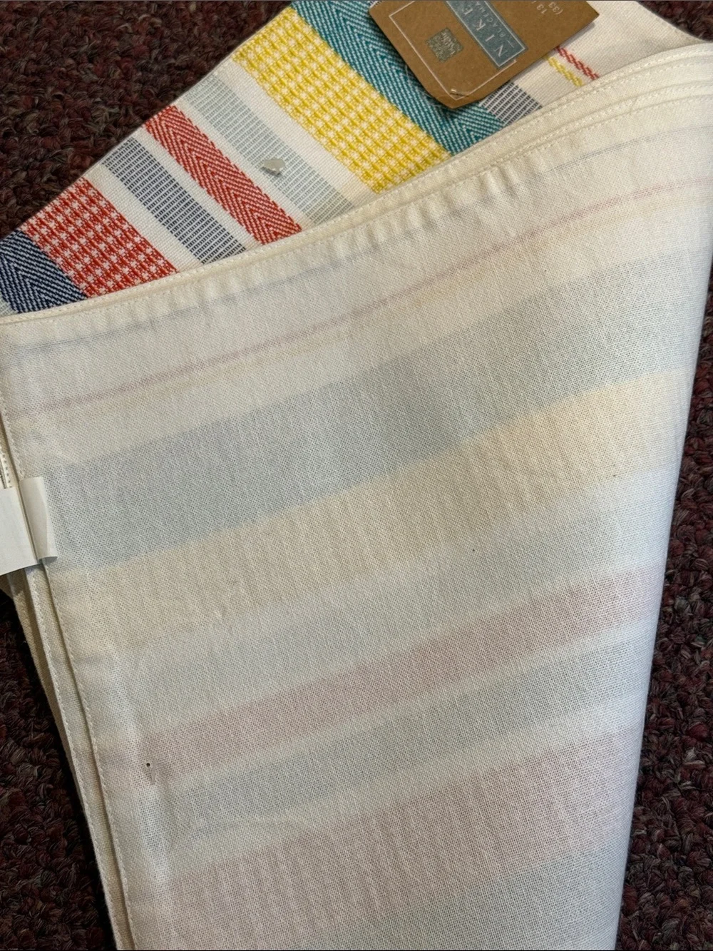 Blue Round Placemat with Multi-Color Striped Kitchen Towel